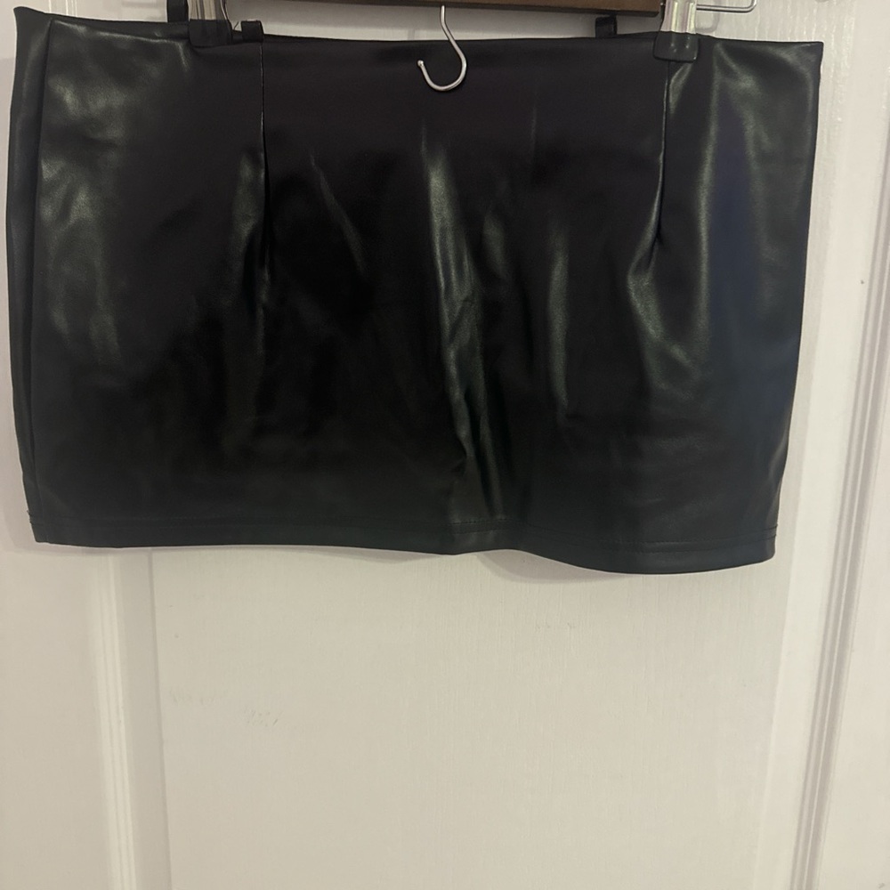 Black faux leather crop top and skirt
